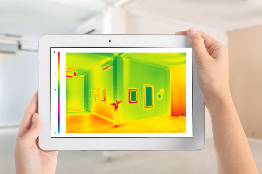 Woman using home infrared thermal imaging