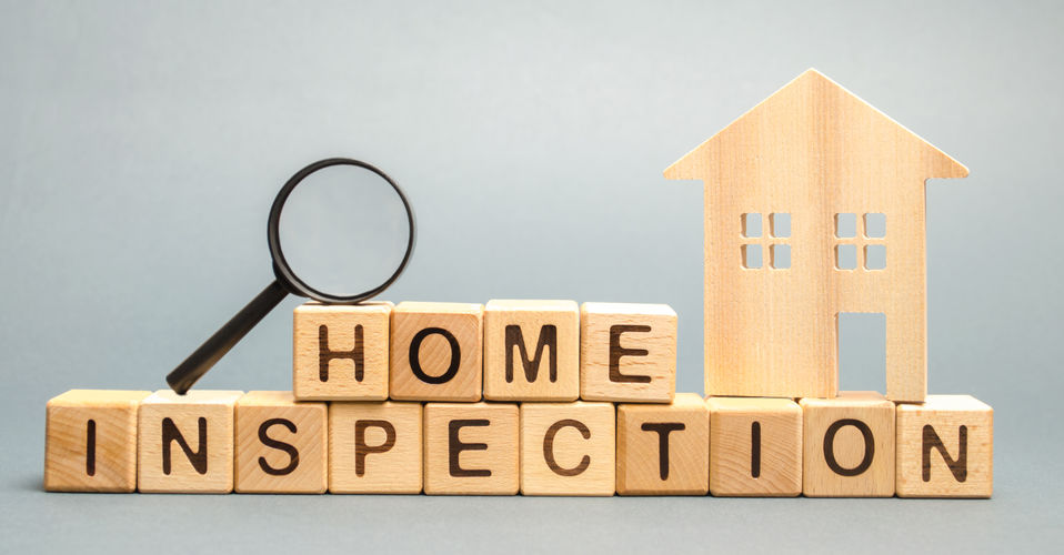 Wooden blocks spelling the word "Home Inspection"