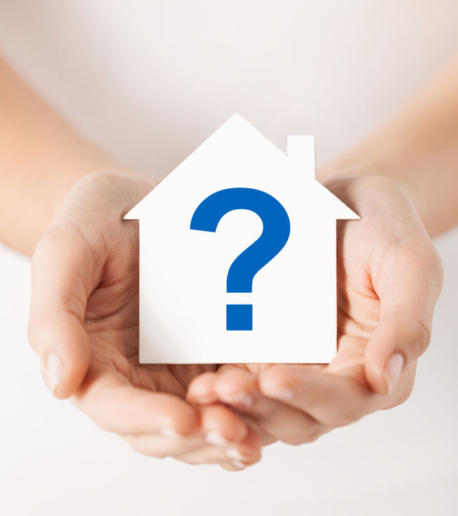 A home with a question mark- signifying questions people may have about the home inspection process